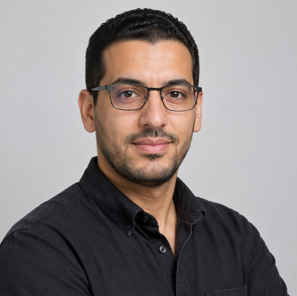 Studio portrait of a Belgian technical director with glasses