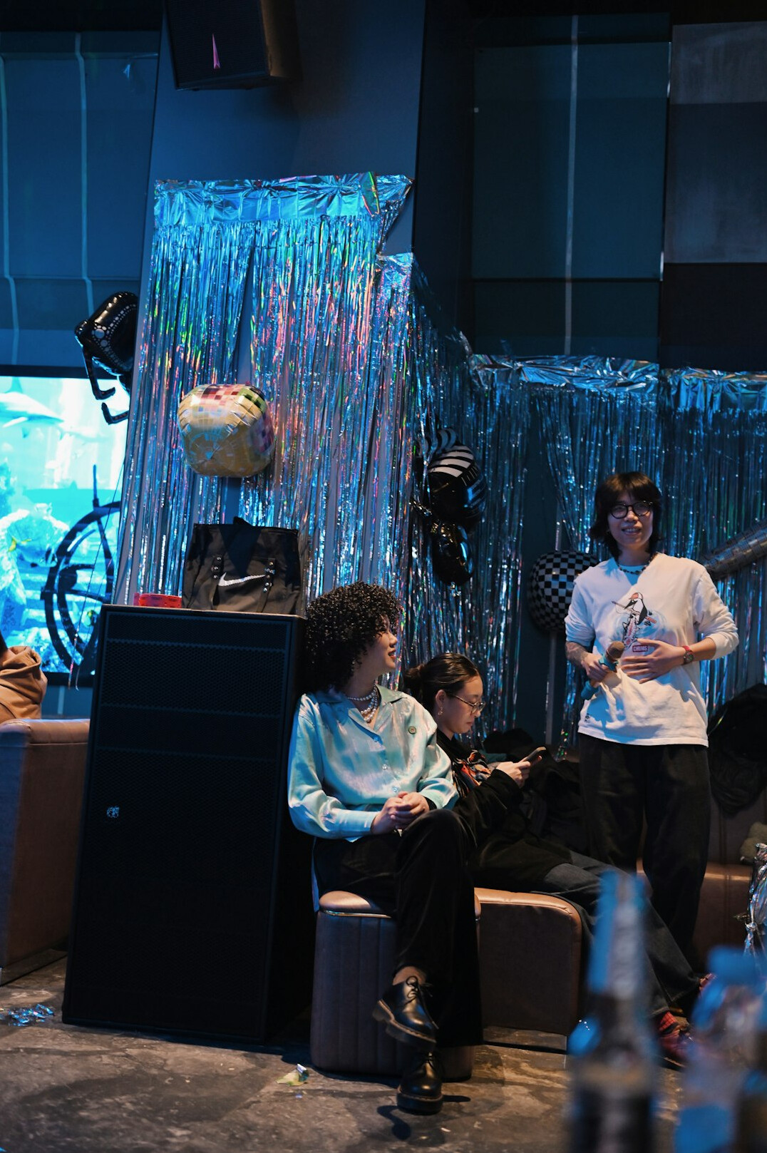 Team of media professionals discussing a live broadcast plan in a newsroom